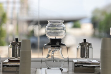 A set of glassware for making tea is placed on the table. A modern tea set for tea lovers. 