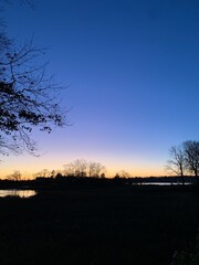 Naklejka premium sunset over the river