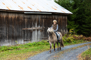 Icelandic horse riding. Rider has werewolf theme outfit