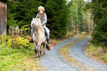 Icelandic horse riding. Rider has werewolf theme outfit