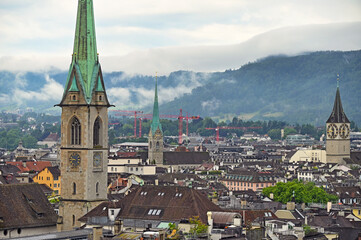 Obraz premium Church clock towers in old town Zurich,cloudy morning,Switzerland