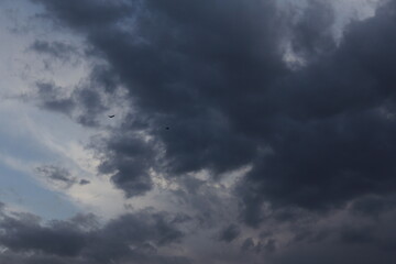 Dark clouds stretching across the sky, adding a sense of mystery and depth to the landscape.