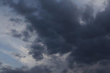 Gathering storm clouds in a dramatic sky, giving a powerful ambiance to the scenery.