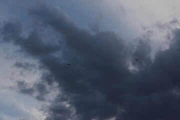 Dark clouds rolling over a mountain, adding a touch of mystery to the majestic landscape.