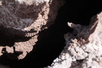 Close-up of deep rock crevices in a desert setting, adding depth and mystery to the natural landscape.