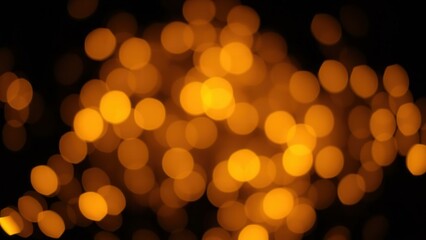 Obraz premium Golden Bokeh Lights: Captivating Warm Glow for Festive Decor, Cozy Ambiance, and Holiday Spirit