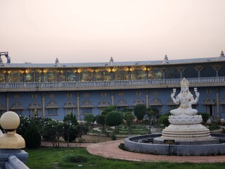 Fototapeta premium Vizianagram, Andhra Pradesh India - Oct 31 2024: Evening View of Ramanaraynam or Ramnaraynam at the modern construction of Rama's Bow and Arrow,statue of Lord Hanumana, goddess Saraswati and Lakshmi .