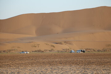 Empty desert landscape with gentle sand dunes, illustrating the quiet and simplicity of nature.