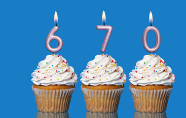 Birthday Cupcakes With Candles Lit Forming The Number 670