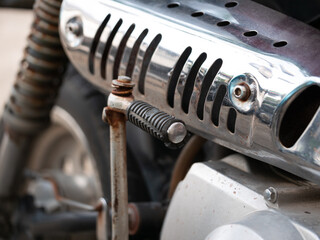 Motorcycle engine part close-up garage workshop mechanical component industrial environment macro viewpoint technical detail