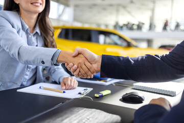 Car dealership, documents and people with handshake in showroom and contract, consulting and...