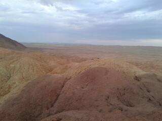 A striking desert rock formation under a clear blue sky, highlighting geological wonder.