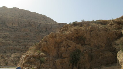 Mountainous landscape with layered rocks, offering a glimpse of geological formations and raw nature.