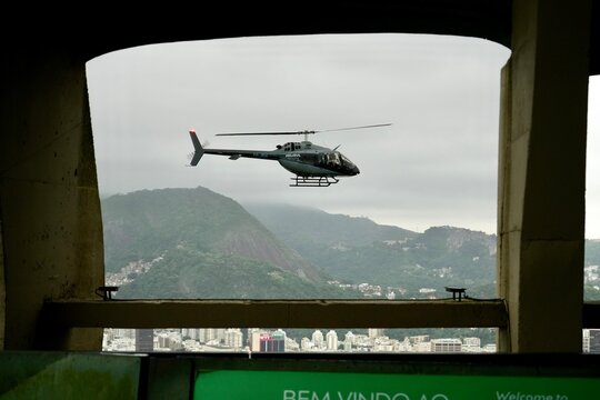 Bell 505 Jet Ranger X Helecopter PP-JRH viwed from a cable car on Sugarloaf Mountain. Rio de Janeiro, Brazil. October 27, 2023. 