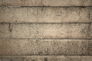 In the photo is a concrete fence made of blocks, close-up