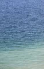 simple background with incredible shades of blue and azure of the sea ideal as backdrop for the concept of travel