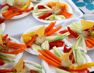 vegetarian dish based on chickpea hummus with carrots, celery, cooked corn flakes