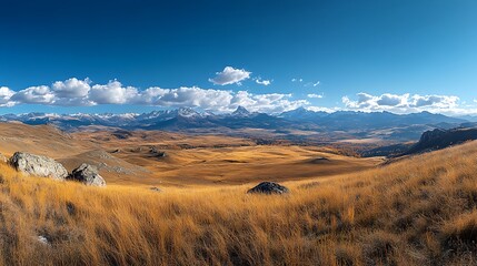 A panoramic view of the Carpathian Mountains with blue sky white clouds