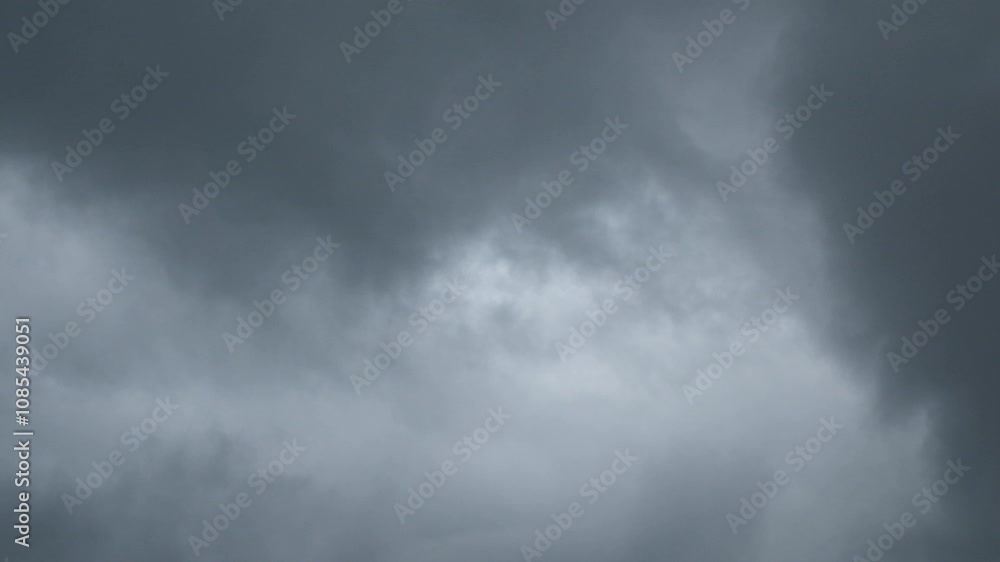 Poster timelapse of dramatic black clouds moving fast in the sky. view of a cloudy sky with abstract patter