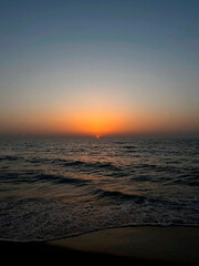 beautiful sea sunset on the beach. calm waves and clear sky