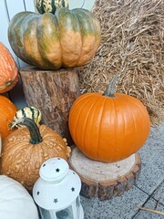 White orange pumpkin outside decoration with candle light autumn season cozy halloween september hay