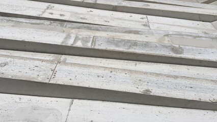 stacked precast concrete elements at a construction site