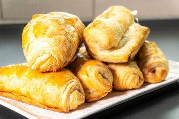 Chocolate rolls made of puff pastry. Dessert. Pastry. Food concept. Puff pastry sticks