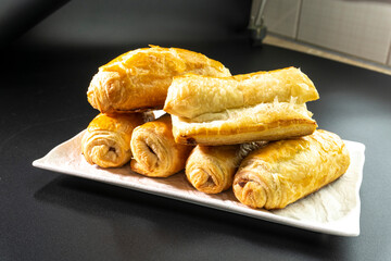 Chocolate rolls made of puff pastry. Dessert. Pastry. Food concept. Puff pastry sticks
