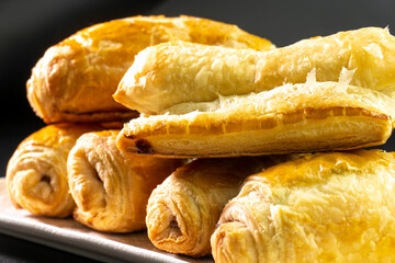 Chocolate rolls made of puff pastry. Dessert. Pastry. Food concept. Puff pastry sticks