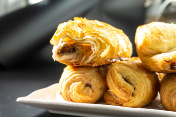 Chocolate rolls made of puff pastry. Dessert. Pastry. Food concept. Puff pastry sticks