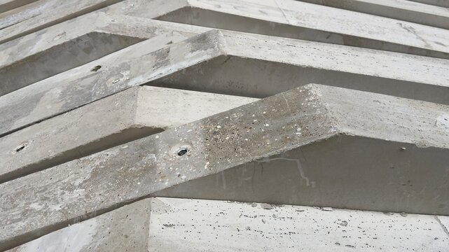 stacked precast concrete elements at a construction site