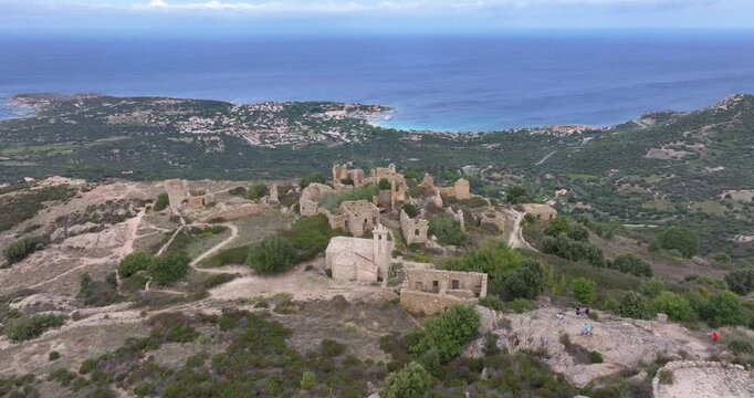 Drone video over the ruins in the abandoned historic village of Occi in western Corsica in summer