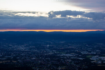 dawn against the backdrop of mountains and a small town