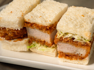 Japanese style clutlet sandwiches on white plate