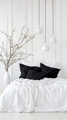 Elegant minimalism in a serene white bedroom with black accents and sophisticated pendant lighting for a tranquil retreat