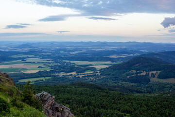 Fototapeta premium dawn against the backdrop of mountains and a small town