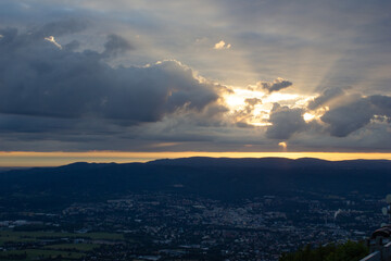 dawn against the backdrop of mountains and a small town