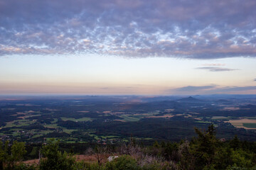 dawn against the backdrop of mountains and a small town