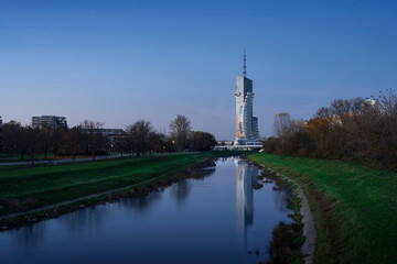 The newest high-rise building in Poland Olszynki Park. The skyscraper is reflected in the Wisłok...