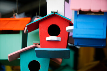 Colorful Birdhouses Hanging Together in a Charming Display, Showcasing Vibrant Paints and Unique Designs Suitable for Outdoor Gardens and Home Decor