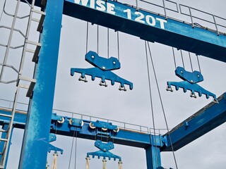 A large blue gantry crane for boats