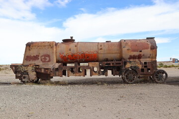 Fototapeta premium Uyuni, Bolivia. 15-05-2024. View of the famous Cementerio de Trenes (Train Cementery)