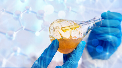 Chemical analysis of composition. Flask is in hands of laboratory assistant. Control of chemical...