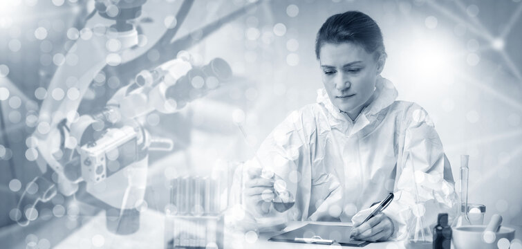 Woman scientist sits at laboratory table. Girl chemist completes scientific experiment. Medic works with electron microscope and test tubes. Woman scientist takes notes on results of experiment.
