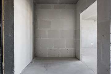 interior of the apartment without decoration in gray colors. rough finish