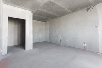interior of the apartment without decoration in gray colors. rough finish