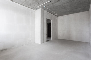 interior of the apartment without decoration in gray colors. rough finish