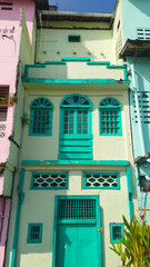 A vibrant, colonial-style building showcasing colorful architectural elements and rich textures