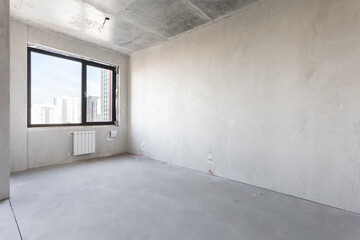 interior of the apartment without decoration in gray colors. rough finish