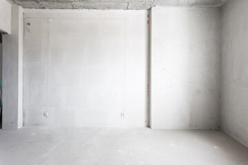 interior of the apartment without decoration in gray colors. rough finish